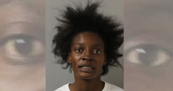 Woman charged for throwing knife at sister, kicking officers and spitting everywhere